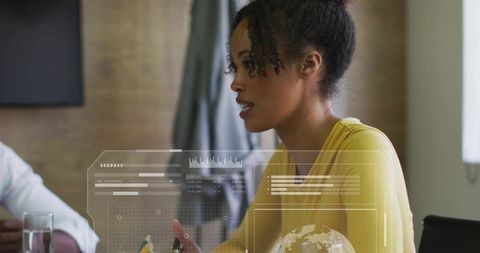 Female leader presenting data-driven dashboard with hud charts, pen gesture, collaboration