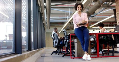 Confident african american entrepreneur in modern office environment