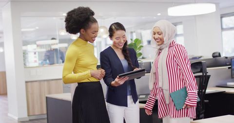 Multicultural Female Colleagues Collaborating in Modern Office - Download Free Stock Images Pikwizard.com