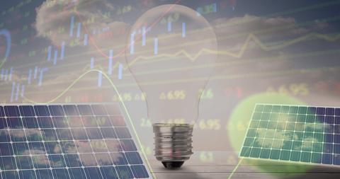 Financial Graphs and Solar Energy with Light Bulb Concept - Download Free Stock Images Pikwizard.com