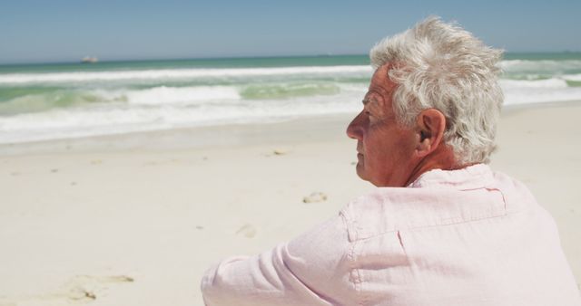 Senior Man Contemplating Ocean View on Sunny Beach - Download Free Stock Images Pikwizard.com