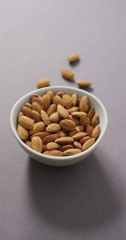 Bowl of Whole Almonds on Lilac Background - Download Free Stock Images Pikwizard.com