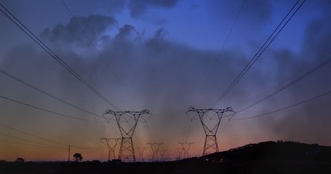 Transmission Towers in Silhouette at Sunset - Download Free Stock Images Pikwizard.com