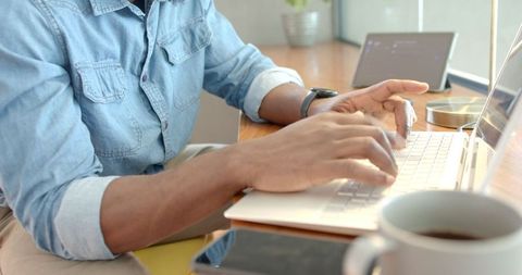 Remote Professional Using Laptop in Home Office Environment