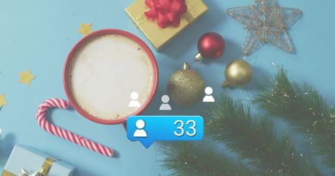 Displaying social followers notification over frothy latte, candy cane, Christmas baubles