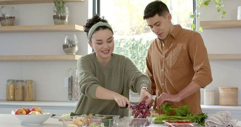 Couple Enjoying Healthy Cooking Lifestyle in Modern Kitchen
