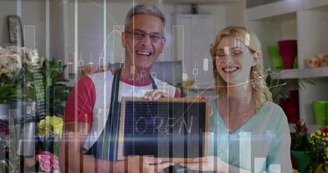 Entrepreneurial florists holding open sign with growth charts overlay