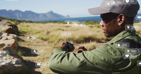 Explorer checking smartwatch on coastal trail with augmented reality social overlays