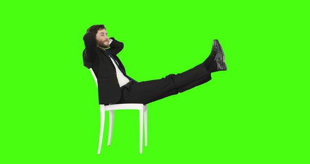 Businessman in formal attire reclining comfortably on a white chair against a green screen. Useful for business-related presentations, advertisements highlighting relaxation and stress management, or any creative project requiring a green screen for easy background replacement.