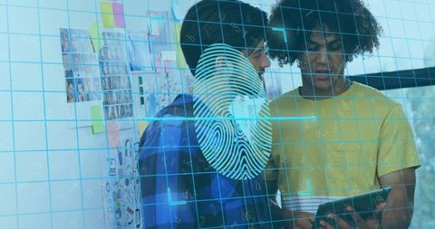 Colleagues analyzing tablet with digital overlay in modern office