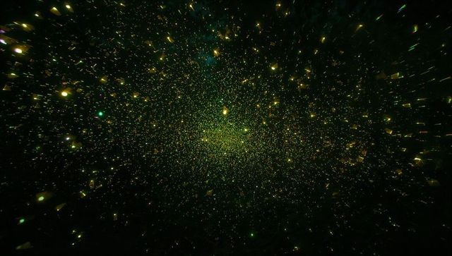 Radiant Green and Gold Cosmic Light Field in Space