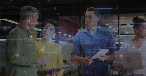 Cross-Functional Team Collaborating with Holographic Data Overlay in Modern Office