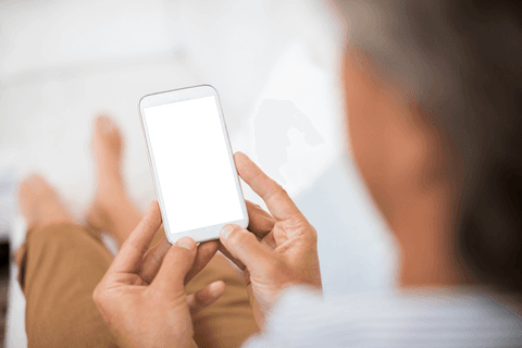 transparent smartphone use by mature man in relaxed home setting - Download Free Stock Videos Pikwizard.com