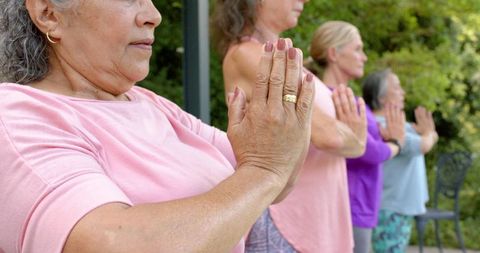 Senior Women Practicing Yoga Outdoors Enhancing Well-being