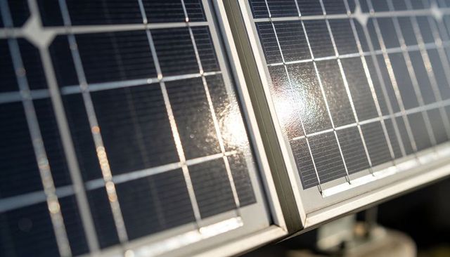Solar Panels Glinting Under Sunlight Close-up Photovoltaic Modules with Aluminum Frame