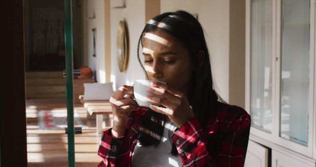 Young Woman Enjoying Morning Coffee in Cozy Sunlit Room - Download Free Stock Images Pikwizard.com