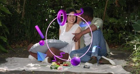 Couple enjoying intimate picnic in shaded garden while playful purple ar graphics swirl