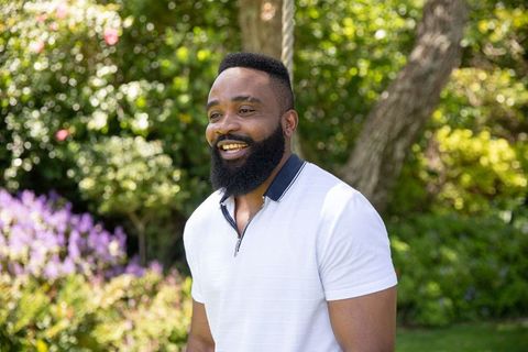 Smiling Man Enjoying Outdoor Garden Environment