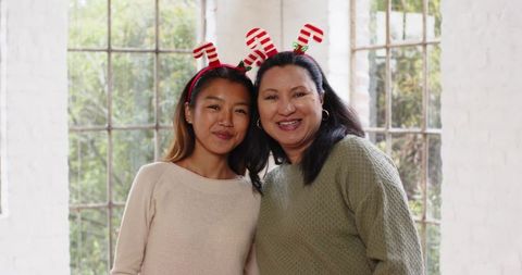 Happy family with candy cane headbands celebrating together