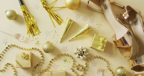 Festive new year's eve party decorations on yellow background