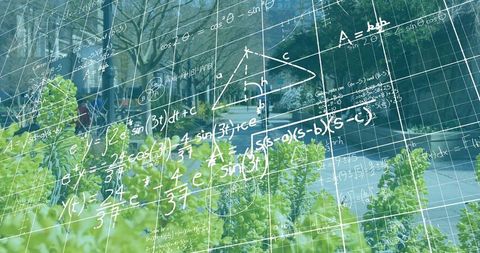 Reflecting math equations on campus glass over green hedge and urban walkway