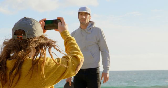 Young Adults Enjoying Photography on Sunny Beach - Download Free Stock Images Pikwizard.com