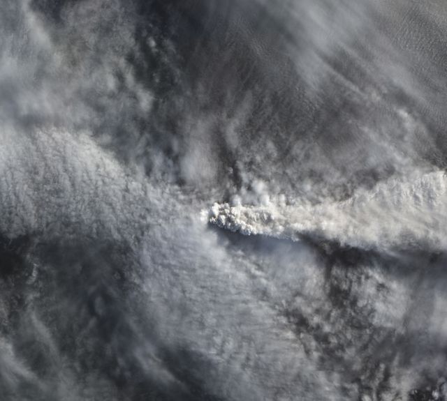 This striking image captures the eruption plume of the Calbuco volcano piercing the cloud deck over Chile, as seen from space on April 25 by NASA's Earth Observing-1 satellite. Useful for educational materials on natural disasters, volcanic activity, or climate studies. Excellent for editorial use in scientific publications, news reports, or environmental awareness campaigns. Thrilling content for geography-related projects or exhibitions.