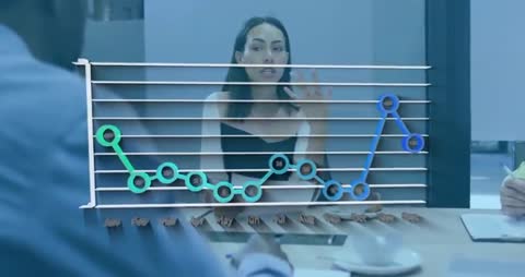 Business Meeting Discussion with Overlaid Financial Graphs
