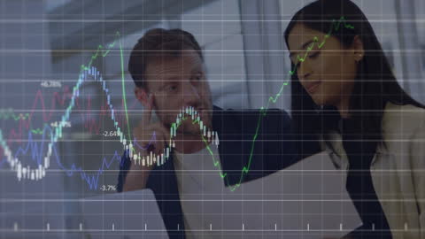 Business Professionals Analyzing Financial Data with Digital Interface