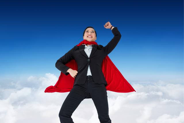 Digital composite of Businesswoman wearing  super hero cape in sky