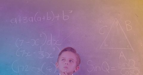 Contemplative Child in Classroom Solving Math Problems - Download Free Stock Images Pikwizard.com