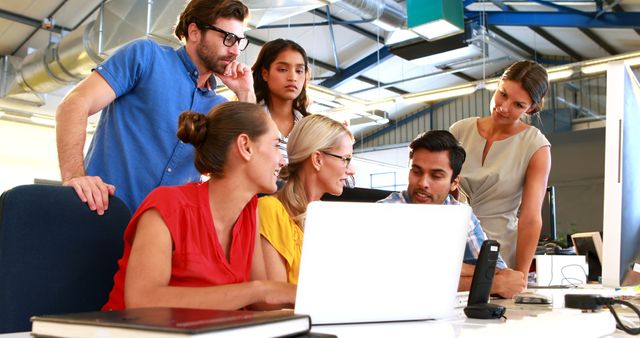 Team Collaborating in Modern Office with Laptops and Natural Light - Download Free Stock Images Pikwizard.com