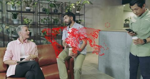 Colleagues relaxing with coffee and technology in modern office lounge