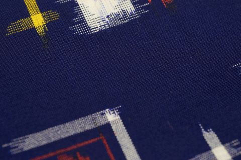Navy textile featuring abstract brushstroke geometric print macro texture