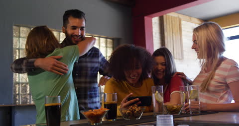 Diverse Friends Enjoying Quality Time at Cozy Pub