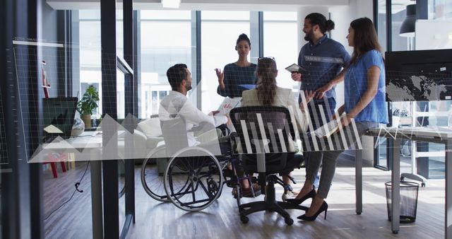 Diverse Team Meeting in Modern Office with Interactive Data Graphics - Download Free Stock Images Pikwizard.com