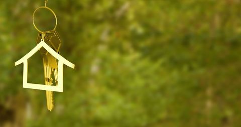 Golden Key with House Keyring Hanging Outdoors Concept - Download Free Stock Images Pikwizard.com