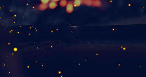 Animated Golden Light Particles on Dark Background