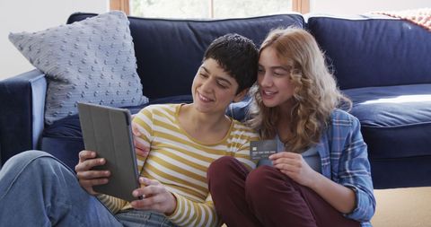 Lesbian Couple Shopping Online with Tablet and Credit Card at Home - Download Free Stock Images Pikwizard.com