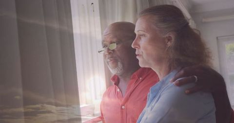 Senior couple enjoying serene home atmosphere with intimate reflection