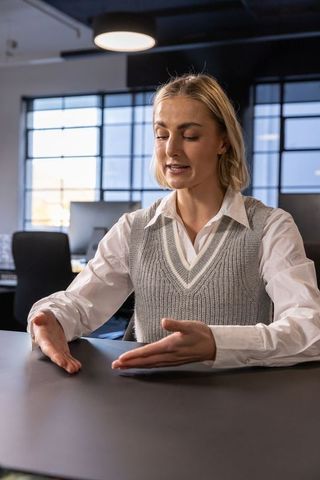 Businesswoman Presenting Ideas in Modern Office Setting