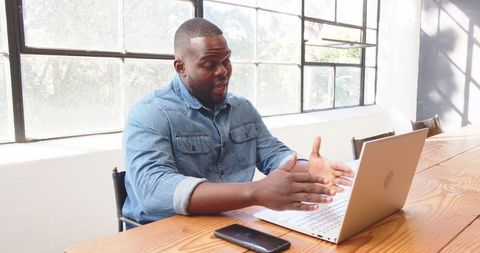 Professional Video Conference with Colleagues at Creative Workspace