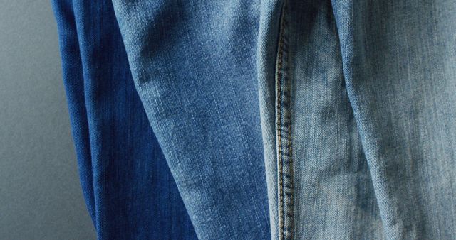 Close up of jeans with different shades with copy space. Denim day, material, style and design concept.