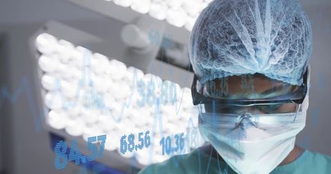 Surgeon Analyzing Data During Surgery in Modern Hospital
