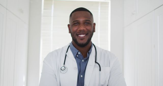 Smiling African American Doctor in White Coat with Stethoscope - Download Free Stock Images Pikwizard.com