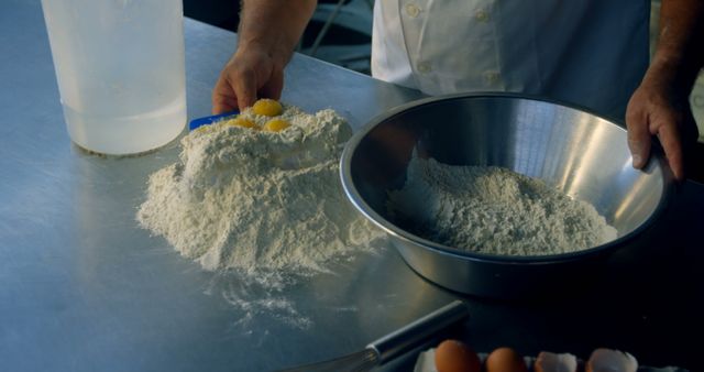 Chef showing a mixing process of eggs and flour in a professional kitchen. Ideal for culinary blogs, cooking tutorials, bakery advertisements, and food-related educational materials. Highlights fundamental baking techniques and professional culinary settings.