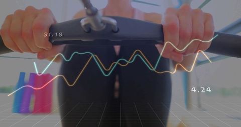 Woman Exercising on Cardio Machine with Digital Performance Analytics