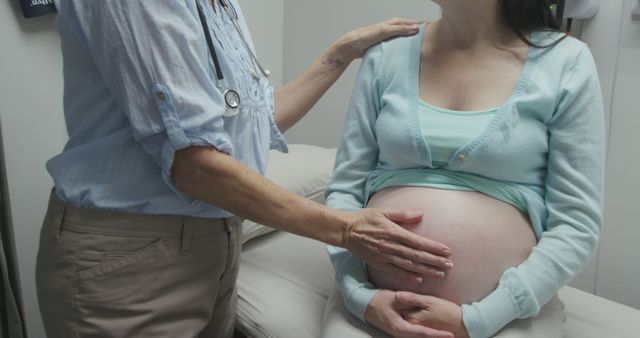 Pregnant Woman Receiving Checkup from Doctor in Clinic - Download Free Stock Images Pikwizard.com