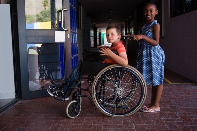 Two students, one in a wheelchair and the other standing, smiling at the school entrance. This image can be used to promote inclusivity, diversity, and accessibility in educational settings. Ideal for educational materials, school brochures, and campaigns advocating for disability rights and inclusive education.