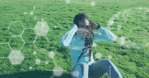 Athletic Woman Exercising with Virtual Chemical Structures Imagery